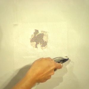 use mesh tape to patch medium sized holes in drywall